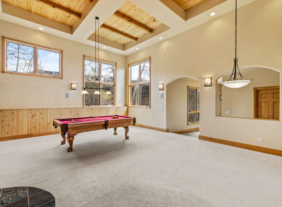 This stunning property boasts a spacious game room, perfect for entertaining and relaxation.