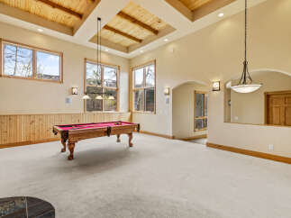 This stunning property boasts a spacious game room, perfect for entertaining and relaxation.