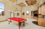 This stunning property boasts a spacious game room, perfect for entertaining.