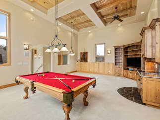 This stunning property boasts a spacious game room, perfect for entertaining.