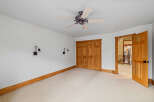 This spacious room features a neutral color palette, creating a bright and inviting atmosphere.