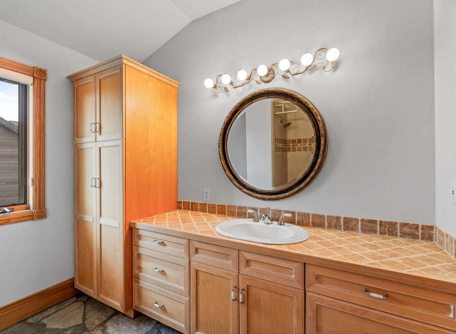 This stunning bathroom boasts a warm and inviting ambiance, perfect for relaxation.