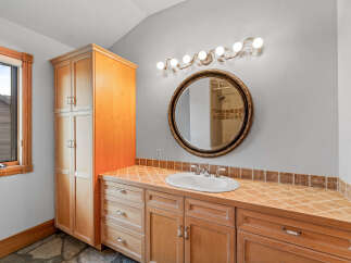 This stunning bathroom boasts a warm and inviting ambiance, perfect for relaxation.