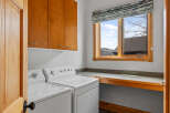 This laundry room offers a blend of functionality and style, perfect for any home.