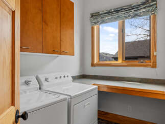 This laundry room offers a blend of functionality and style, perfect for any home.