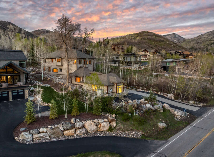 Nestled in a serene mountain setting, this stunning property boasts luxurious homes with modern architecture.
