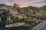 Nestled in a serene mountain setting, this stunning property boasts luxurious homes with modern architecture.