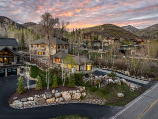 Nestled in a serene mountain setting, this stunning property boasts luxurious homes with modern architecture.