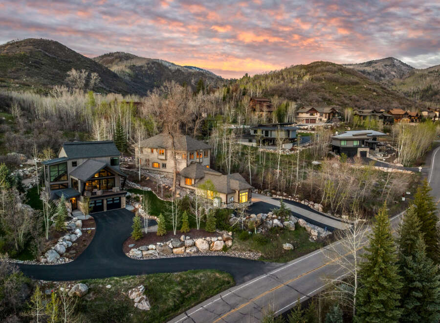 Luxury homes nestled in a picturesque mountain setting.