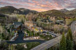 Luxury homes nestled in a picturesque mountain setting.