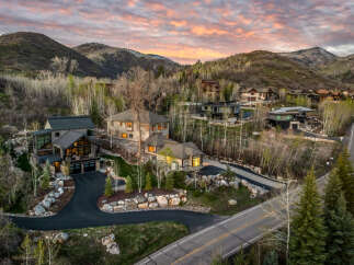Luxury homes nestled in a picturesque mountain setting.