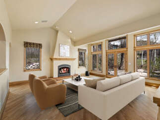 Experience luxury living in this stunning property featuring a cozy fireplace, perfect for chilly evenings.