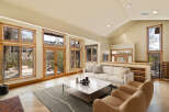 This stunning living room boasts an open and airy design, perfect for entertaining or relaxing.