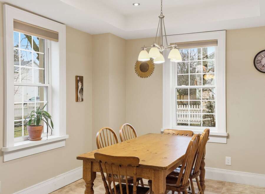 This charming dining room features a warm, inviting atmosphere, perfect for family meals and gatherings.