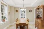 Step into this charming dining room, perfect for family gatherings and entertaining guests.