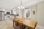 This bright and airy kitchen and dining area offers a perfect blend of functionality and style.