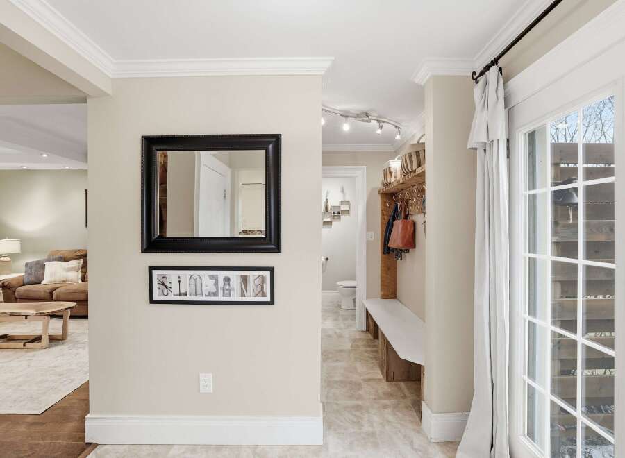 This inviting entryway showcases a blend of style and functionality, perfect for welcoming guests.