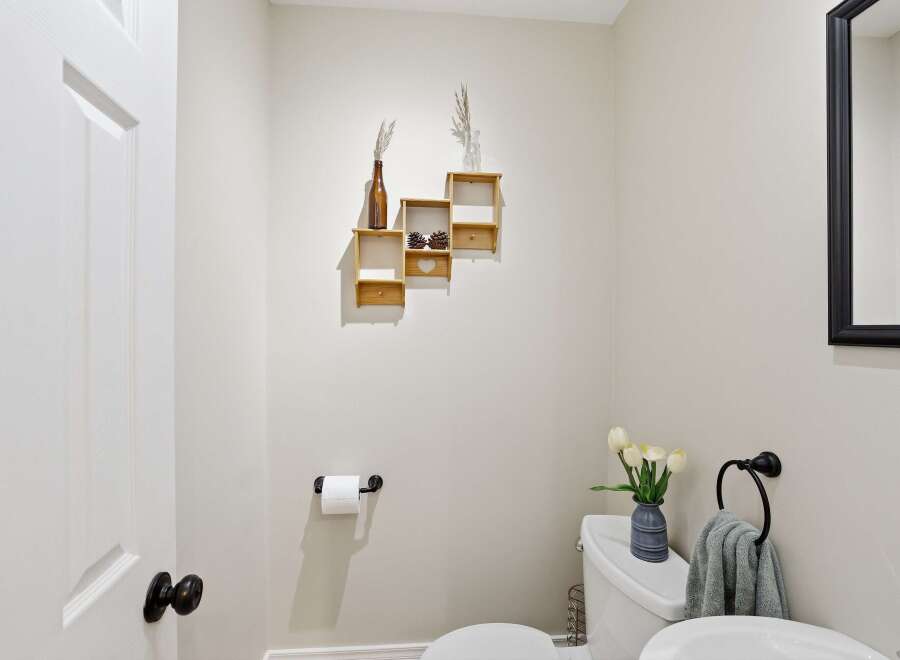 This charming powder room offers a blend of style and functionality.