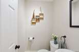 This charming powder room offers a blend of style and functionality.