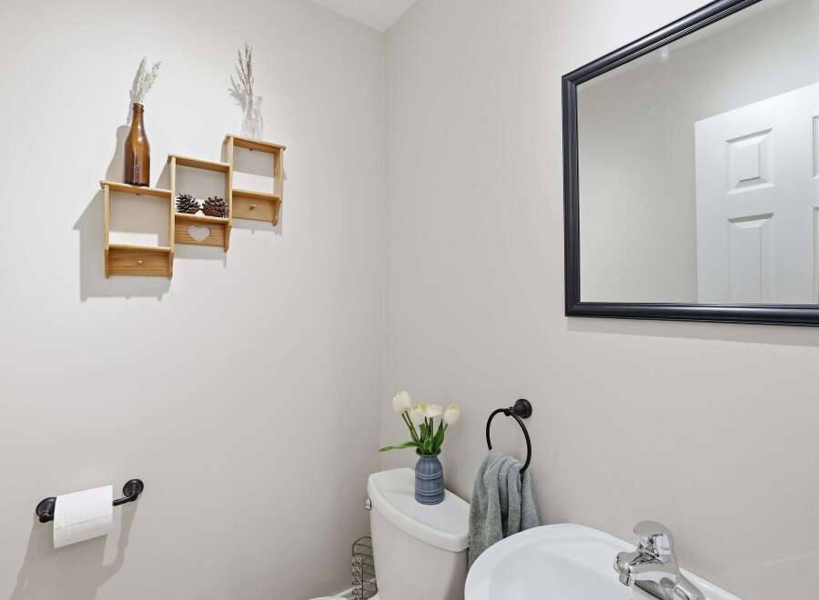 This stunning bathroom features a modern design with a touch of rustic charm.