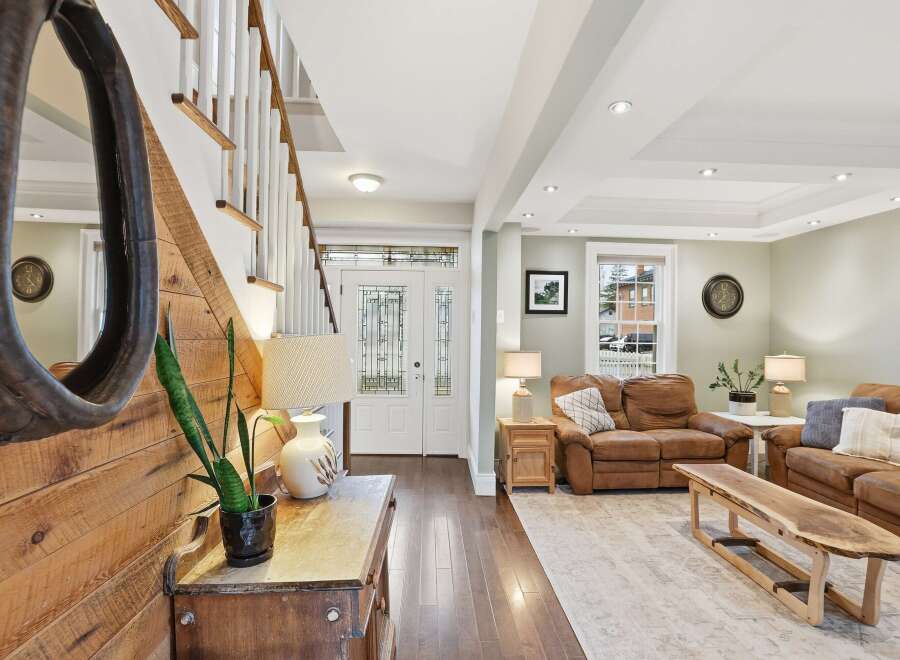 Step into this inviting home and be greeted by a stunning entryway with a beautiful staircase.
