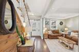 Step into this inviting home and be greeted by a stunning entryway with a beautiful staircase.