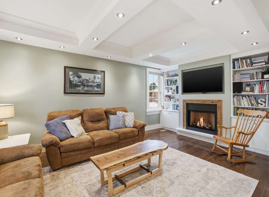 This inviting living room features a cozy fireplace, perfect for relaxing evenings.