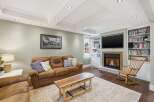 This inviting living room features a cozy fireplace, perfect for relaxing evenings.