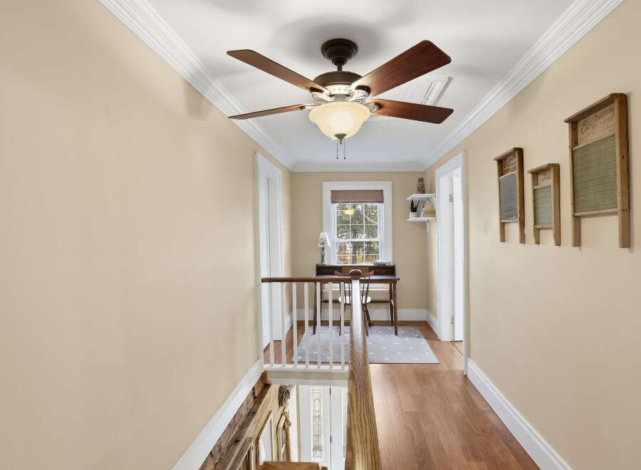 This charming hallway features a warm and inviting atmosphere, perfect for any home.