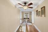 This charming hallway features a warm and inviting atmosphere, perfect for any home.