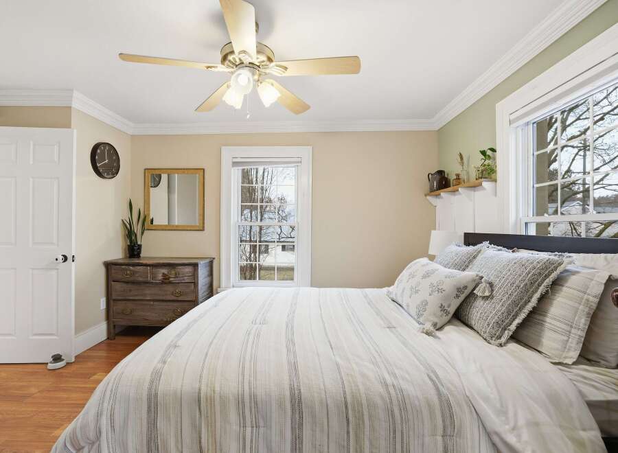 This charming bedroom offers a cozy retreat with its inviting ambiance and stylish decor.