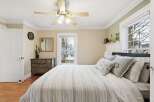 This charming bedroom offers a cozy retreat with its inviting ambiance and stylish decor.
