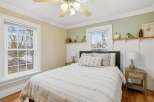 This charming bedroom offers a serene retreat with its inviting ambiance and stylish decor.