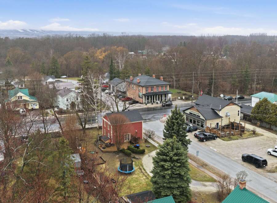 This charming property offers a unique blend of residential and commercial spaces, perfect for those seeking a live-work lifestyle.
