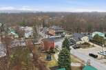 This charming property offers a unique blend of residential and commercial spaces, perfect for those seeking a live-work lifestyle.