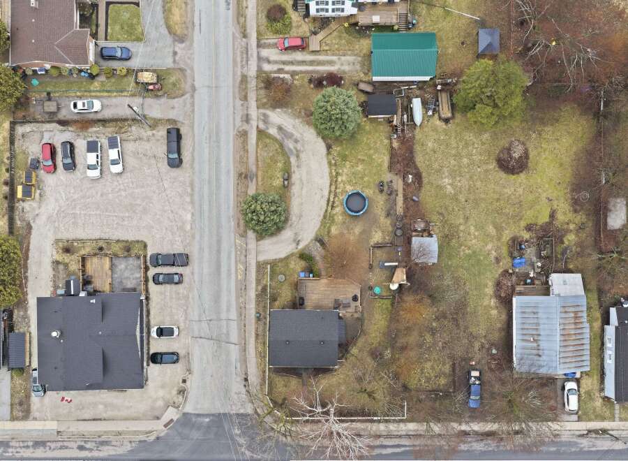 This aerial view showcases a charming residential area with a mix of homes and well-maintained properties.