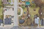 This aerial view showcases a charming residential area with a mix of homes and well-maintained properties.