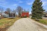 This charming property features a spacious yard with a trampoline, perfect for outdoor fun.