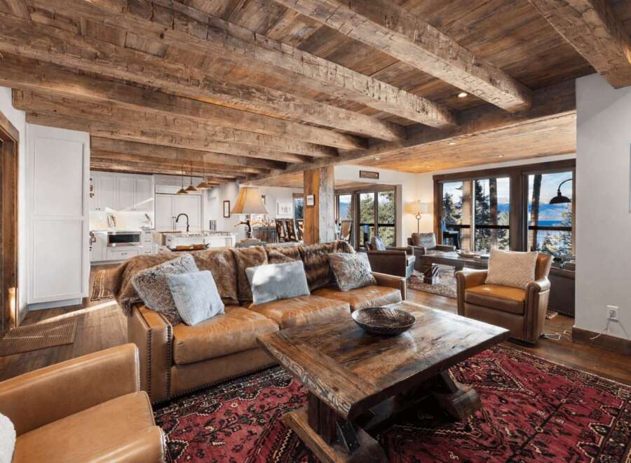 Experience rustic elegance in this stunning property, featuring exposed wooden beams and a cozy living space.