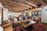 Experience rustic elegance in this stunning property, featuring exposed wooden beams and a cozy living space.