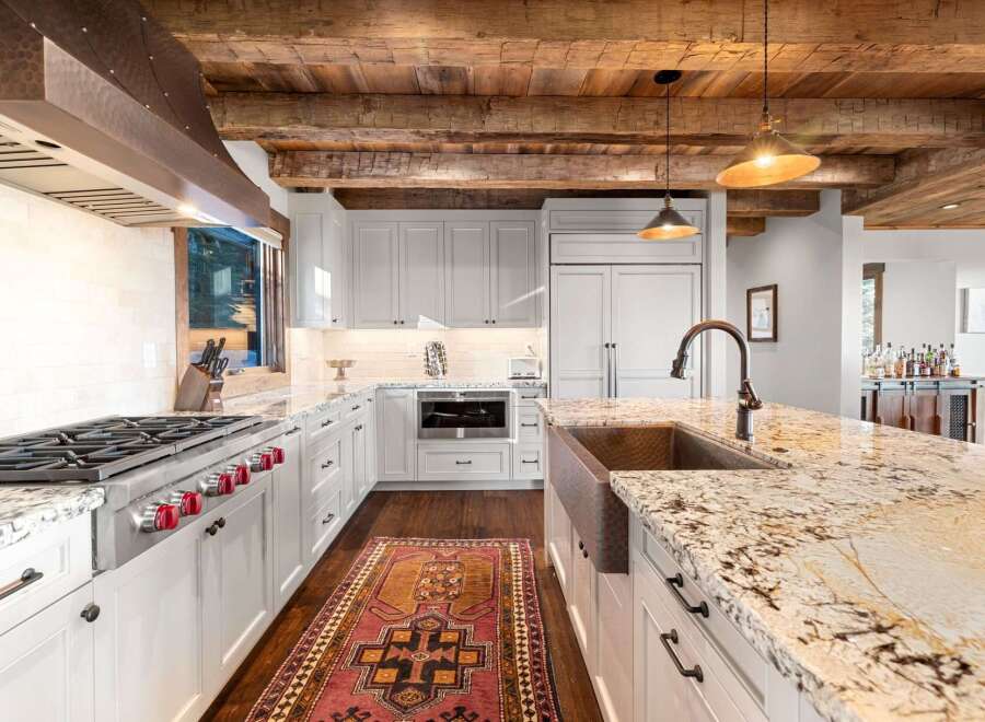 This stunning kitchen boasts a rustic yet elegant design, perfect for any home.