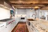 This stunning kitchen boasts a rustic yet elegant design, perfect for any home.