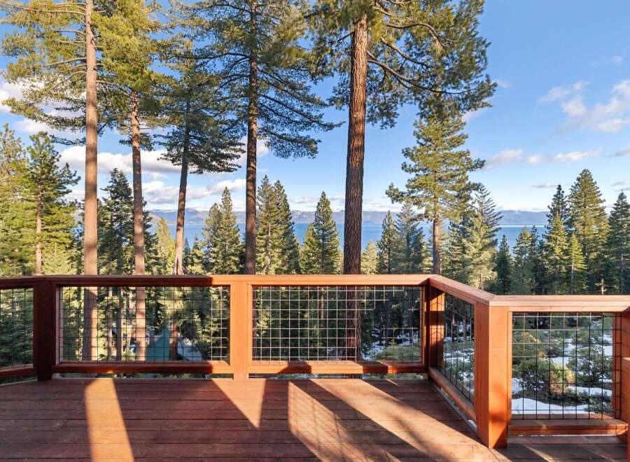 Enjoy breathtaking views from this stunning property, featuring a spacious deck perfect for entertaining or relaxing.