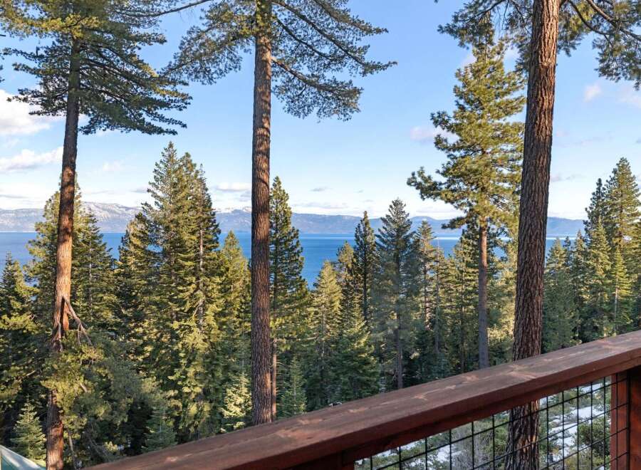 Enjoy breathtaking views of the lake and surrounding mountains from this stunning property.