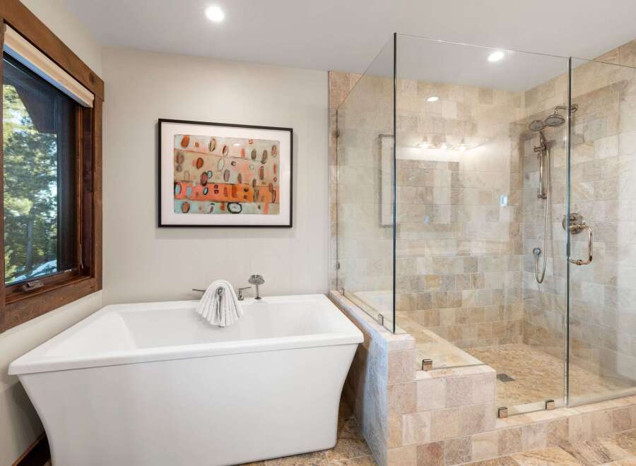 This luxurious bathroom features a modern freestanding bathtub, perfect for relaxing after a long day.