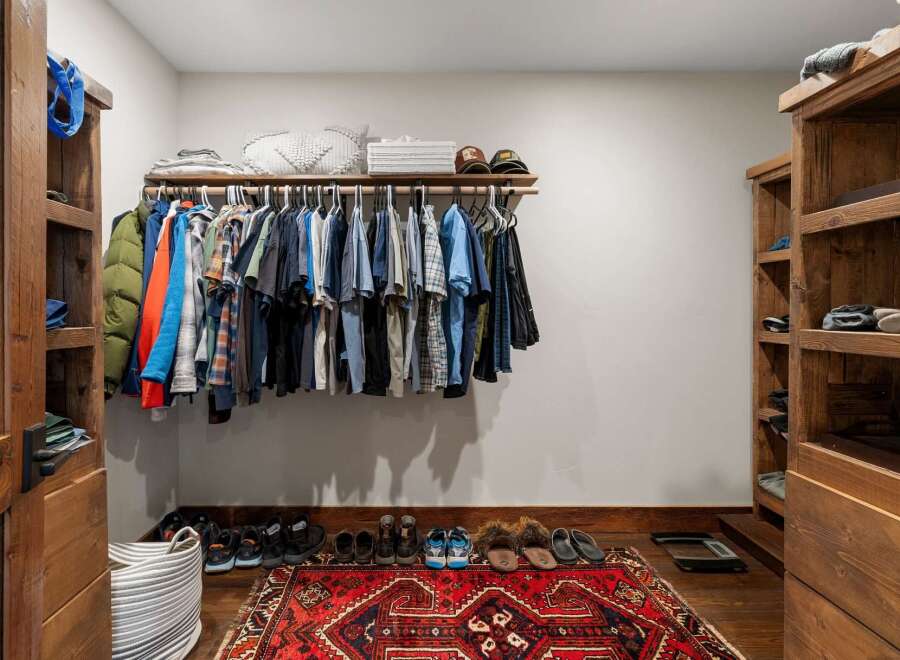 Step into luxury with this stunning walk-in closet, designed for both style and functionality.