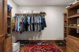 Step into luxury with this stunning walk-in closet, designed for both style and functionality.