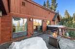Experience luxury living in this stunning property featuring a private hot tub and a cozy outdoor fireplace, perfect for relaxing evenings.