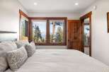 Experience the tranquility of this stunning bedroom with breathtaking views.