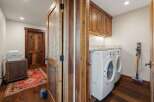Step into this beautifully designed laundry room, featuring a modern washer and dryer set.